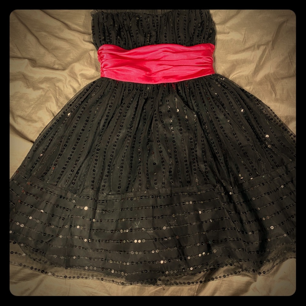 Black dress with a pink waist band